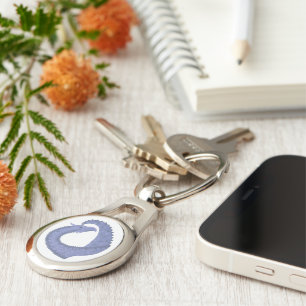 Blue-grey heart dragon on white key ring