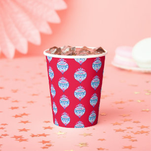 Blue hand drawn Christmas ornaments on bright red Paper Cups
