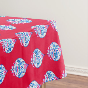 Blue hand drawn Christmas ornaments on bright red Tablecloth