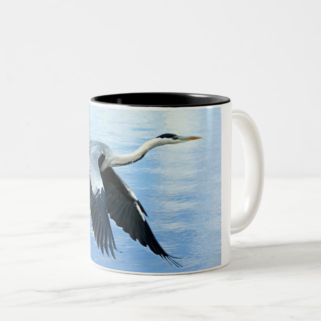 Blue Heron in Flight Over Water Two-Tone Coffee Mug (Front Right)