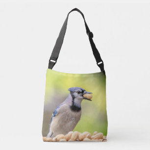 Blue jay with a peanut crossbody bag