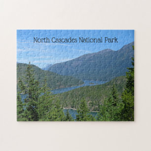 Blue Lake Winds Through Green Forested Mountains Jigsaw Puzzle