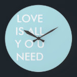Blue Love is All You Need Custom White Text Large Clock<br><div class="desc">Blue and white "All you need is love" custom text template personalised round wall clock with quotes. Custom typography wall clock template, by red_dress, featuring the white text "Love is All you Need" on a blue customisable background. Easily personalise written text wall clocks with your favourite colours and quotes. Click...</div>