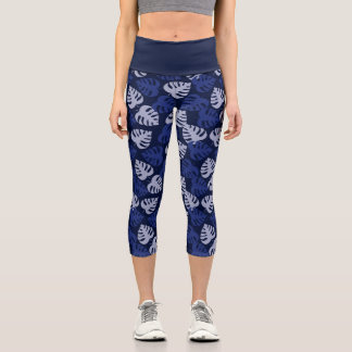 Blue monstera leaf pattern on deep navy capri leggings