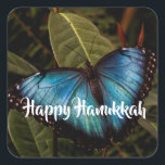 Blue Morpho, Butterfly Happy Hanukkah Square Sticker<br><div class="desc">Blue Morpho butterfly shows off his brilliant,  blue wings ( 5 - 8 inches span) while resting on foliage at Butterfly Wonderland. Ready to send your Hanukkah greetings. Photo by Ruth Jolly. The text is fully customisable to meet your needs.</div>