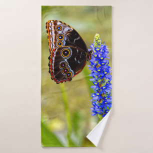 Blue morpho butterfly on a marsh orchid bath towel set