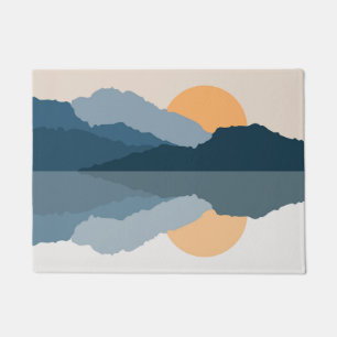 Blue mountains reflected in the lake doormat