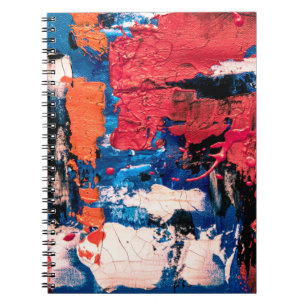 Blue, orange, red, and black painting notebook