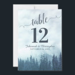 Blue Pine Trees Wedding Table Number Card Large<br><div class="desc">These beautiful wedding table number cards feature an elegant yet rustic design with a fancy script calligraphy title and a backdrop of blue mountain pine trees shrouded in mist or fog. These cards are larger than standard making it easy for your guests to find their tables. Perfect way to make...</div>