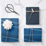 Blue plaid and stars classic wrapping paper sheet<br><div class="desc">A bold modern take on a classic plaid makes this wrapping paper set perfect way for both traditional and unconventional gift givers. The blue background with the tilted black and white checks is chic and stylish. Will look fantastic on all your gifts under the tree perfectly coordinated with your Christmas...</div>