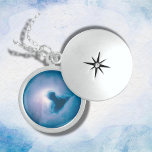 Blue Reflection Nebula in Orion | Locket Necklace<br><div class="desc">The Blue Reflection Nebula in Orion serves as not only a breathtaking sight in the night sky but also an important area for astronomical study. It provides insights into the processes of star formation and the interactions between young stars and the surrounding interstellar medium.
Sterling Silver Locket Necklace.</div>