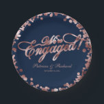 Blue Rose Gold We're Engaged Engagement Party Paper Plate<br><div class="desc">Elegant calligraphy engagement party paper plate. Easy to personalise with your details. Please get in touch with me via chat if you have questions about the artwork or need customisation. PLEASE NOTE: For assistance on orders,  shipping,  product information,  etc.,  contact Zazzle Customer Care directly https://help.zazzle.com/hc/en-us/articles/221463567-How-Do-I-Contact-Zazzle-Customer-Support-.</div>