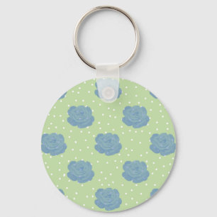 Blue rose pattern on green backround key ring