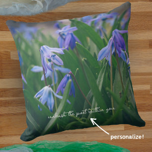Blue scilla flowers in the spring garden cushion