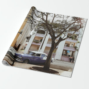 BLUE SEDAN PARKED NEAR WHITE BUILDING WRAPPING PAPER