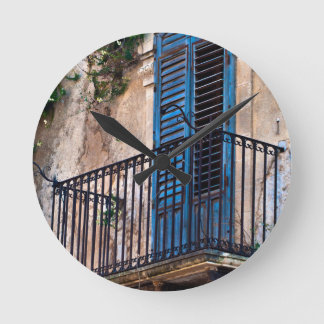 Blue Sicilian Door on the Balcony Round Clock