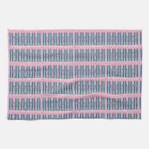 Blue skis on pink kitchen towel
