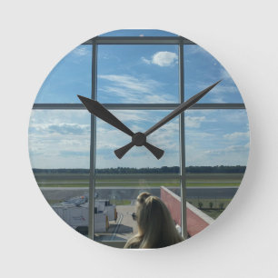 blue sky airport window photo round clock