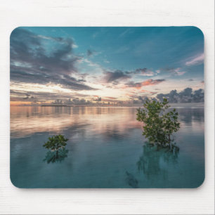 blue sky with red and dark clouds reflected on sea mouse mat