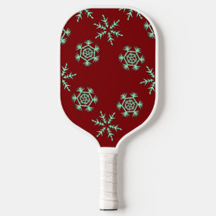 Blue snowflakes on red pickleball paddle