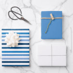 Blue  Striped White Wrapping Paper Sheet<br><div class="desc">This wrapping paper set features a multi shade blue stripe pattern on the first sheet,  sheet two coordinates with a solid blue and sheet three is solid white.</div>