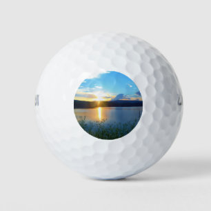 Blue sunset on lake golf balls