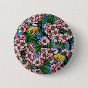 Blue tit birds in the blooming cherry tree on blue 6 cm round badge