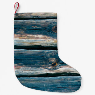 Blue toned log house wall. Abstract background and Small Christmas Stocking