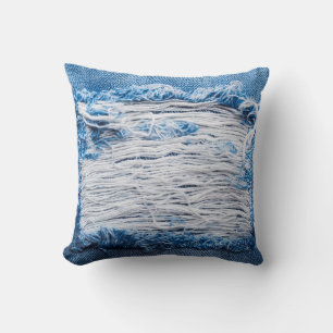 Blue torn denim jeans texture with space for text cushion