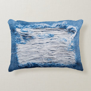 Blue torn denim jeans texture with space for text decorative cushion