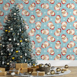 Blue Vintage Santa Claus Christmas Wallpaper<br><div class="desc">Bring the magic of the holidays into your home with this blue vintage Santa Claus Christmas wallpaper. Featuring charming illustrations of Santa's cheerful face and delicate snowflakes against a blue background, this design adds a festive and nostalgic touch to any room. Perfect for creating a cosy and merry atmosphere, this...</div>