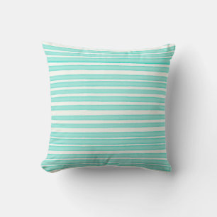 Blue watercolor stripes on white cushion