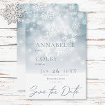 Blue Winter Snow Modern Wedding Save The Date<br><div class="desc">Embrace the magic of a winter wonderland with our enchanting wedding save the date card. Imagine a soft, dusty blue canvas reminiscent of a twilight sky, sprinkled with delicate white snowflakes as they gently fall. Ethereal bokeh lights shimmer above, evoking a sense of joyous celebration. A crisp white base, mimicking...</div>