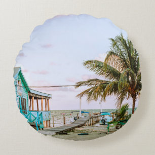 BLUE WOODEN HOUSE NEAR BODY OF WATER ROUND CUSHION