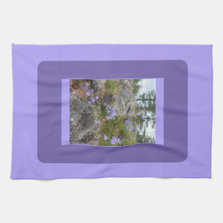 Bluebells on a rocky hillside tea towel