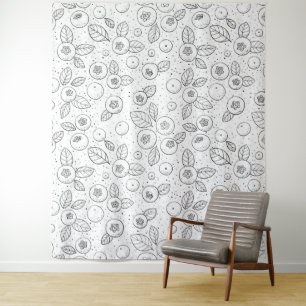 Blueberries on black and white tapestry
