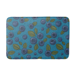 Blueberries on blue bath mat