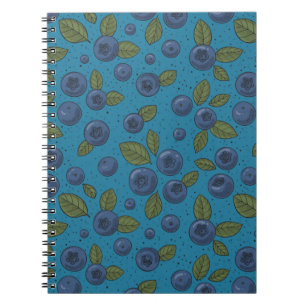 Blueberries on blue notebook