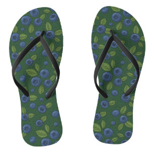Blueberries on dark green flip flops