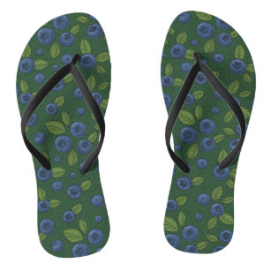 Blueberries on dark green flip flops