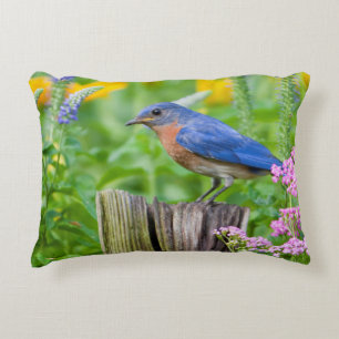 Bluebird male on fence post in flower garden decorative cushion