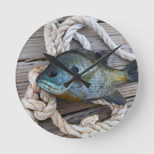 Bluegill fish on dock and rope round clock