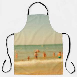 Blurred beach photo with bokeh. People relaxing on Apron
