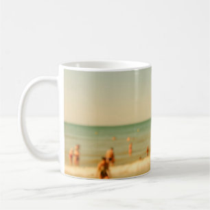 Blurred beach photo with bokeh. People relaxing on Coffee Mug