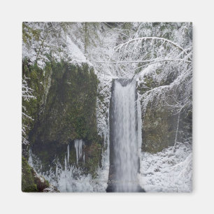 Blurry Waterfall Surrounded by a Snowy Forest Magnet