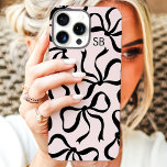 Blush And Black Bow Monogram iPhone 16 Pro Max Case<br><div class="desc">Dress up your phone in style with this chic and trendy blush pink and black phone case! Featuring a playful pattern of hand-drawn bows and personalised with your monogram, this case is the perfect blend of fashion and function. Made from durable materials to protect your phone from everyday bumps and...</div>