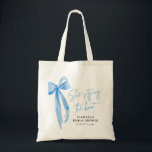 Blush Blue Bow She's Tying the Knot Bridal Shower  Tote Bag<br><div class="desc">Introducing the Blush Blue Bow She's Tying the Knot" Bridal Shower Tote Bag – the perfect keepsake for celebrating the bride-to-be! This elegant tote bag features a blush background with a beautiful blue bow design, adding a touch of sophistication to any bridal shower. Made from durable, eco-friendly fabric, this spacious...</div>