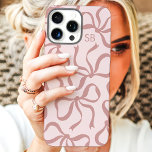 Blush Pink Bow Monogram iPhone 16 Pro Max Case<br><div class="desc">Dress up your phone in style with this chic and trendy blush pink phone case! Featuring a playful pattern of hand-drawn bows and personalised with your monogram, this case is the perfect blend of fashion and function. Made from durable materials to protect your phone from everyday bumps and scratches. A...</div>