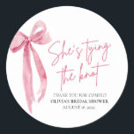 Blush Pink Bow She's Tying the Knot Bridal Shower Classic Round Sticker<br><div class="desc">The Blush Pink Bow: She's Tying the Knot Bridal Shower Classic Round Sticker is a delightful addition to any bridal shower celebration. With its elegant blush pink bow design, this sticker adds a touch of sophistication and charm to favours, envelopes, or decor. Whether used to seal envelopes, adorn gift bags,...</div>