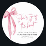 Blush Pink Bow She's Tying the Knot Bridal Shower Classic Round Sticker<br><div class="desc">The Blush Pink Bow: She's Tying the Knot Bridal Shower Classic Round Sticker is a delightful addition to any bridal shower celebration. With its elegant blush pink bow design, this sticker adds a touch of sophistication and charm to favours, envelopes, or decor. Whether used to seal envelopes, adorn gift bags,...</div>